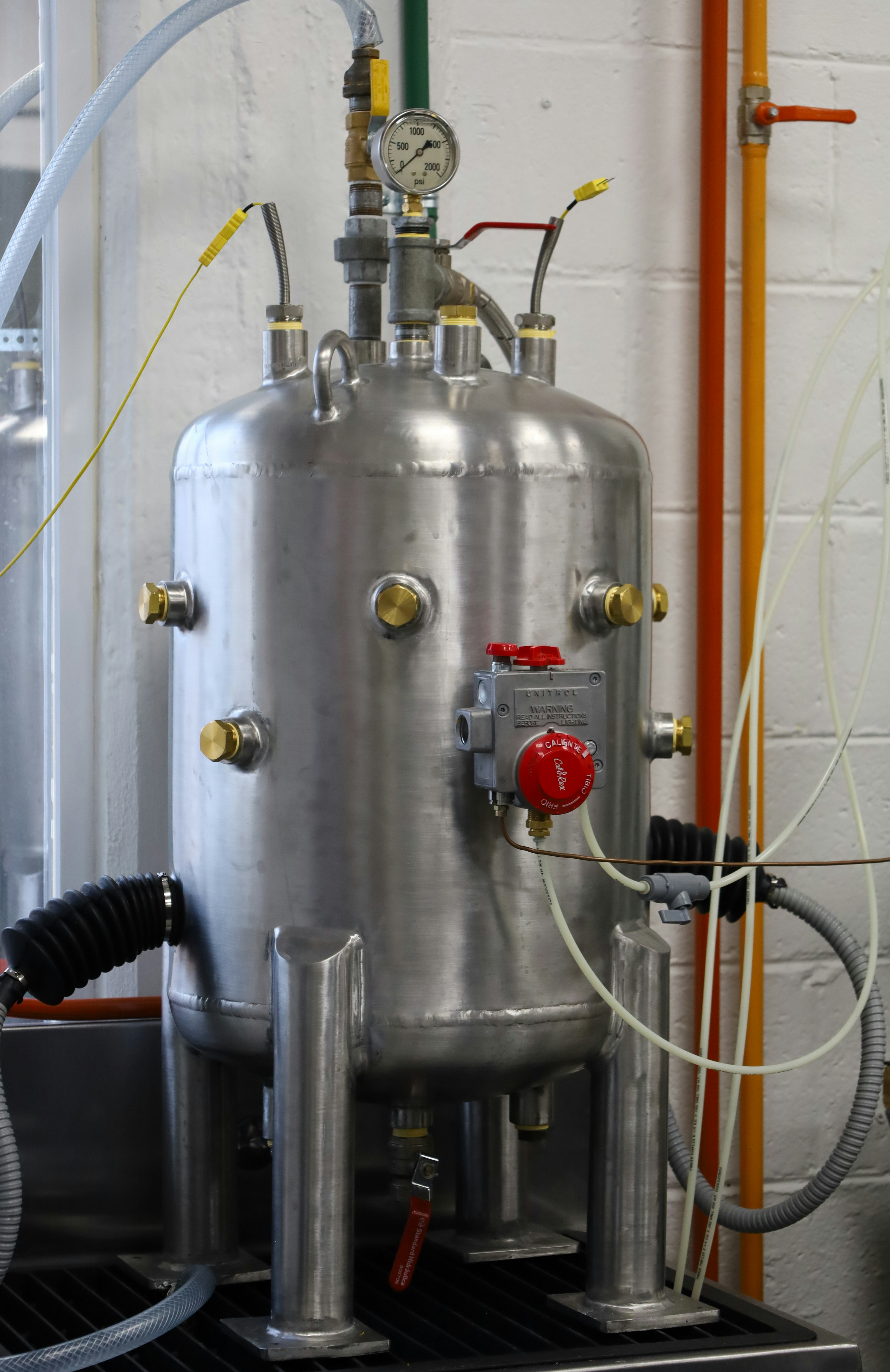 Water treatment professional inspecting residential equipment